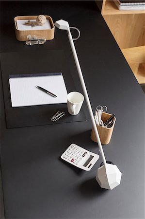 Objects and modern lamp on home office desk Stock Photo - Premium Royalty-Free, Code: 6113-07565733