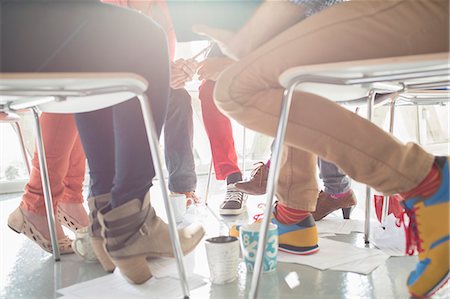 simsearch:6113-07565839,k - Close up of creative business people meeting in circle of chairs Stock Photo - Premium Royalty-Free, Code: 6113-07565841