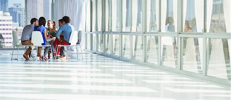 person business - Creative business people meeting in circle of chairs Stock Photo - Premium Royalty-Free, Code: 6113-07565846