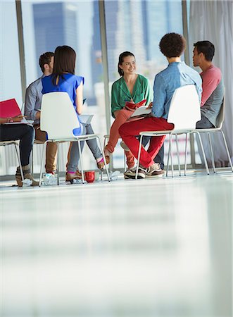 simsearch:6113-07565839,k - Creative business people meeting in circle of chairs Stock Photo - Premium Royalty-Free, Code: 6113-07565882