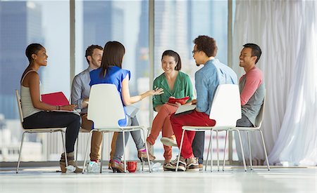 simsearch:6113-07565839,k - Creative business people meeting in circle of chairs Stock Photo - Premium Royalty-Free, Code: 6113-07565886