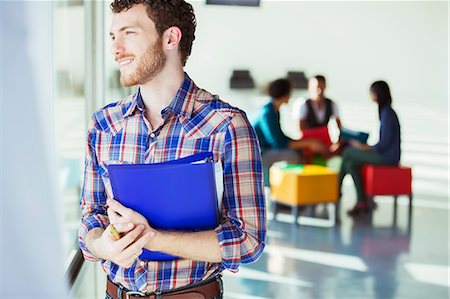 simsearch:6113-06909277,k - Distracted casual businessman looking out window outside meeting Stock Photo - Premium Royalty-Free, Code: 6113-07565898