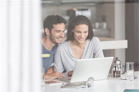 spouse - Couple using laptop at table Stock Photo - Premium Royalty-Free, Code: 6113-07565810