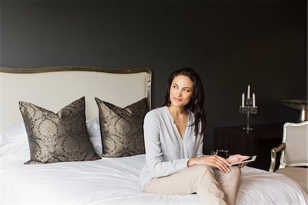 simsearch:6113-07565805,k - Happy woman using digital tablet in bedroom Stock Photo - Premium Royalty-Free, Code: 6113-07565832