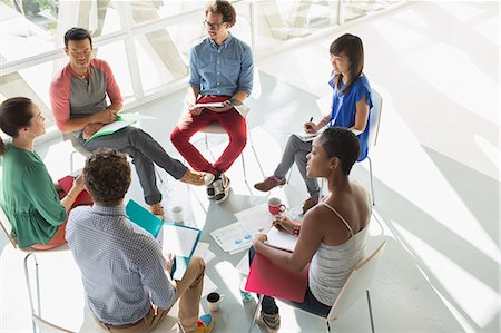 simsearch:6113-07565839,k - Creative business people meeting in circle of chairs Stock Photo - Premium Royalty-Free, Code: 6113-07565933