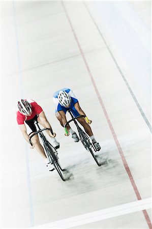 simsearch:6113-07588662,k - Track cyclists racing in velodrome Stock Photo - Premium Royalty-Free, Code: 6113-07588667