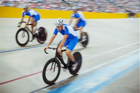 simsearch:6113-07588662,k - Track cycling team riding in velodrome Stock Photo - Premium Royalty-Free, Code: 6113-07588681