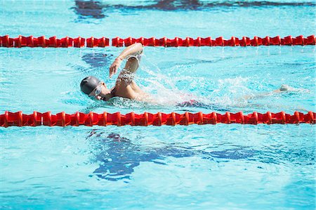 swimmer (male) - Swimmer racing in pool Stock Photo - Premium Royalty-Free, Code: 6113-07588768