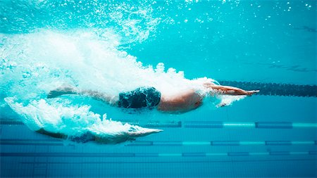 power speed - Swimmers racing in pool Stock Photo - Premium Royalty-Free, Code: 6113-07588714