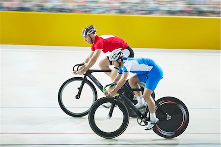simsearch:6113-07588662,k - Track cyclists racing in velodrome Stock Photo - Premium Royalty-Free, Code: 6113-07588715