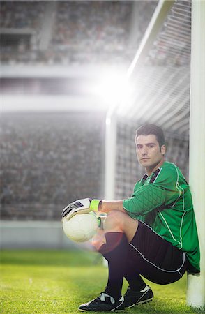 simsearch:6113-07588867,k - Goalie holding soccer ball by net Stock Photo - Premium Royalty-Free, Code: 6113-07588853