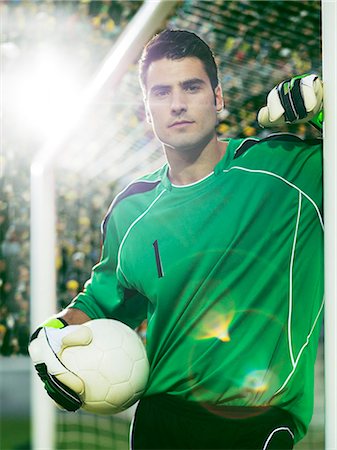 simsearch:6113-07588867,k - Goalie holding soccer ball in net Stock Photo - Premium Royalty-Free, Code: 6113-07588861