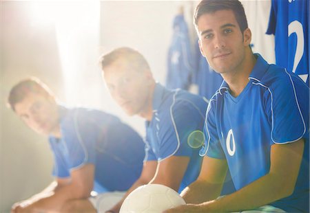 football players in lockerroom - Soccer players sitting in locker room Stock Photo - Premium Royalty-Free, Code: 6113-07588890