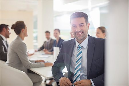 Portrait of confident businessman in conference room Stock Photo - Premium Royalty-Free, Code: 6113-07588945