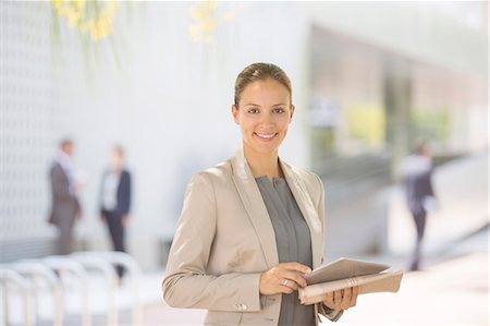success smile outdoors - Portrait of confident businesswoman with digital tablet Stock Photo - Premium Royalty-Free, Code: 6113-07588946