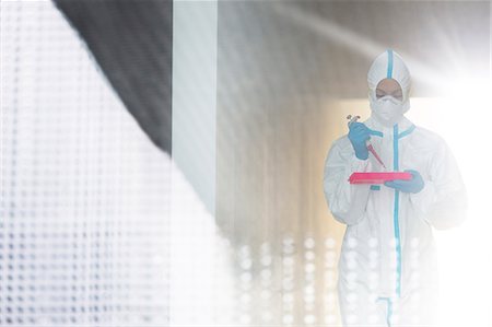 simsearch:6113-07589192,k - Scientist in clean suit with pipette and tray Stock Photo - Premium Royalty-Free, Code: 6113-07588989