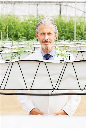 simsearch:6113-07589172,k - Portrait of confident botanist in greenhouse Stock Photo - Premium Royalty-Free, Code: 6113-07589172