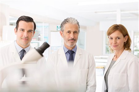 simsearch:6113-07589172,k - Portrait of confident scientists in laboratory Stock Photo - Premium Royalty-Free, Code: 6113-07589129