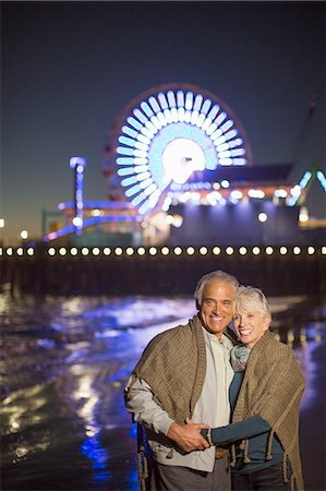 senior couple posing - Portrait of senior couple on beach at night Stock Photo - Premium Royalty-Free, Code: 6113-07589472