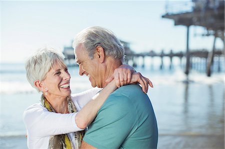 Senior couple hugging on beach Stock Photo - Premium Royalty-Free, Code: 6113-07589401
