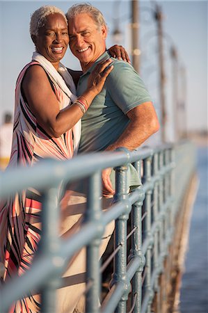 simsearch:6113-07589438,k - Portrait of smiling senior couple hugging on pier Stock Photo - Premium Royalty-Free, Code: 6113-07589500