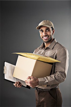 delivery - Portrait of confident deliveryman Stock Photo - Premium Royalty-Free, Code: 6113-07648740