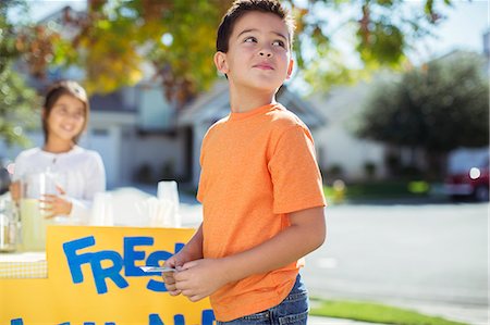 pitcher (sports) - Boy buying lemonade at lemonade stand Stock Photo - Premium Royalty-Free, Code: 6113-07648805