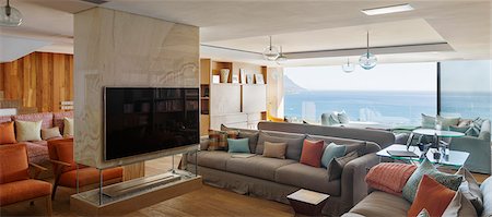simsearch:6113-07589638,k - Modern living room with ocean view Foto de stock - Sin royalties Premium, Código: 6113-07648955