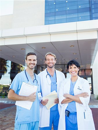 doctor posing - Doctors and nurse smiling outside hospital Stock Photo - Premium Royalty-Free, Code: 6113-07761981