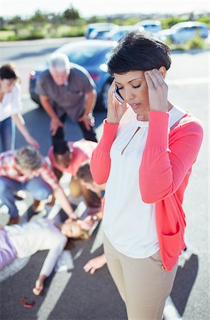 Woman calling emergency services at car accident Stock Photo - Premium Royalty-Free, Code: 6113-07761998