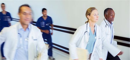 simsearch:6113-07762019,k - Doctors and nurses rushing in hospital hallway Stock Photo - Premium Royalty-Free, Code: 6113-07762016