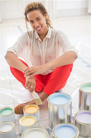 simsearch:6113-07762308,k - Woman overlooking space with paint cans near Stock Photo - Premium Royalty-Free, Code: 6113-07762242