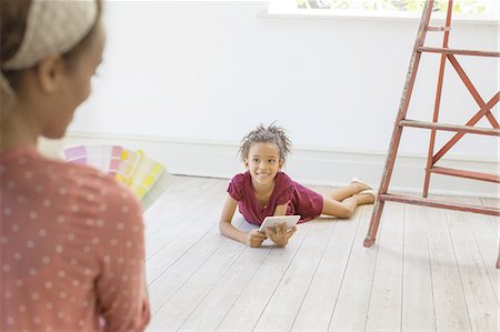 simsearch:6113-07762308,k - Young girl using digital tablet in living space Stock Photo - Premium Royalty-Free, Code: 6113-07762292