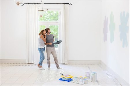 diy or home improvement - Couple looking at paint swatches together Stock Photo - Premium Royalty-Free, Code: 6113-07762214
