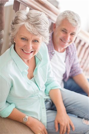 steps inside house - Older couple sitting together on stairs Stock Photo - Premium Royalty-Free, Code: 6113-07762225