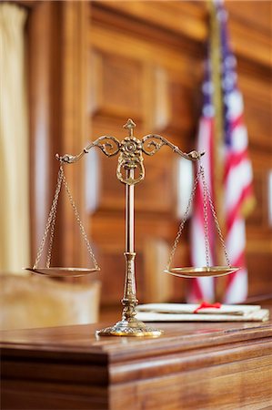 Scales of justice on the judge's bench Stock Photo - Premium Royalty-Free, Code: 6113-07762362