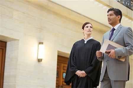 Judge and lawyer talking in courthouse Stock Photo - Premium Royalty-Free, Code: 6113-07762374