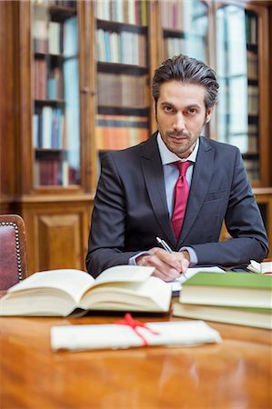 Lawyer doing research in chambers Stock Photo - Premium Royalty-Free, Code: 6113-07762385