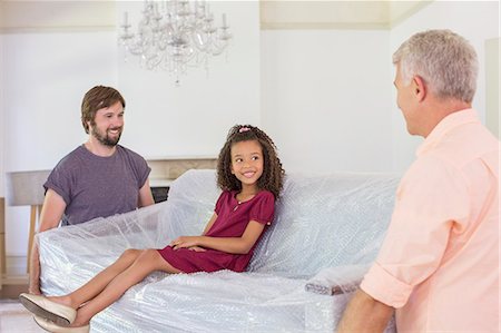 simsearch:6113-07648804,k - Family carrying couch with young girl sitting on top Stock Photo - Premium Royalty-Free, Code: 6113-07762307
