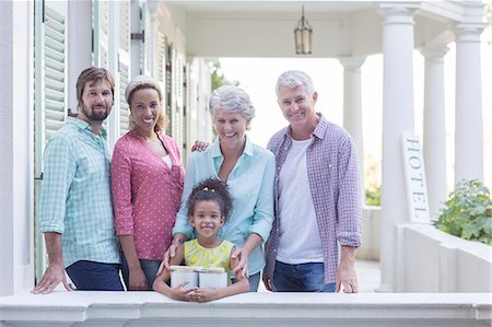 family, hotel - Family smiling on porch together Stock Photo - Premium Royalty-Free, Code: 6113-07762329