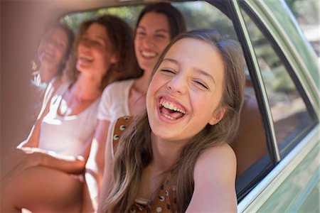 picture of happy person in a car - Four women playing in car backseat Stock Photo - Premium Royalty-Free, Code: 6113-07762488