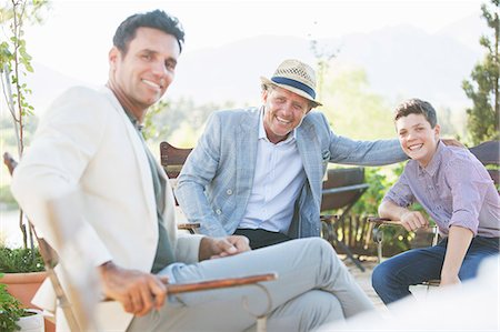 simsearch:6113-07648804,k - Three generations of men relaxing outdoors Stock Photo - Premium Royalty-Free, Code: 6113-07762580