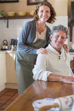 Older couple relaxing in the kitchen Stock Photo - Premium Royalty-Free, Code: 6113-07762607