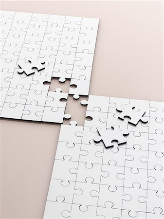 simsearch:6113-07589120,k - Close up of connecting puzzle with scattered pieces Stock Photo - Premium Royalty-Free, Code: 6113-07790184