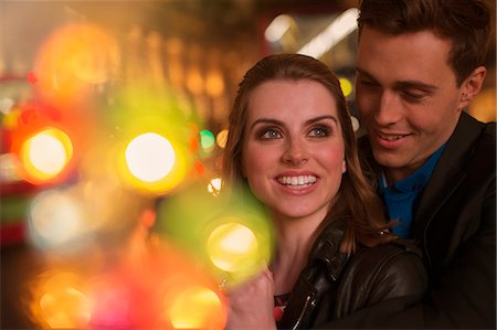 Couple hugging on city street at night Stock Photo - Premium Royalty-Free, Code: 6113-07790263