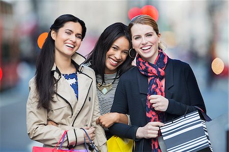 shopping bags city street - Friends walking down city street together Stock Photo - Premium Royalty-Free, Code: 6113-07790217