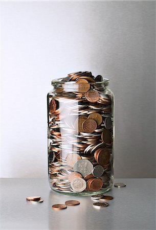 Change jar overflowing on counter Stock Photo - Premium Royalty-Free, Code: 6113-07790419