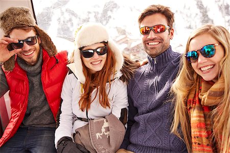 simsearch:6113-07790711,k - Friends smiling together on ski lift Photographie de stock - Premium Libres de Droits, Code: 6113-07790614
