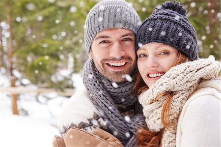 snowflakes  holiday - Couple hugging in snow Stock Photo - Premium Royalty-Free, Code: 6113-07790711