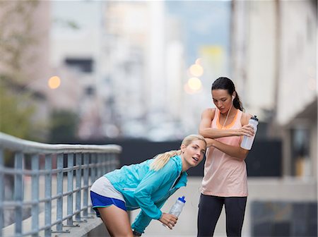 simsearch:6113-07790833,k - Women resting after exercising on city street Stock Photo - Premium Royalty-Free, Code: 6113-07790826